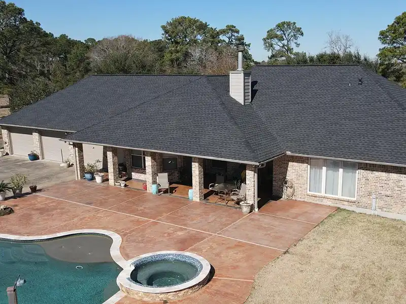 Mid-class home with new black roof shingles