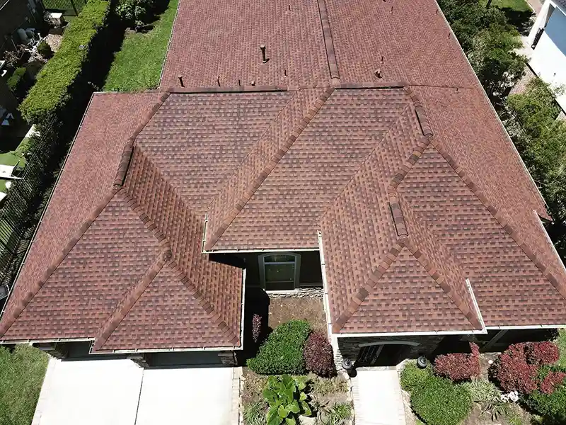 Home with new red shingles